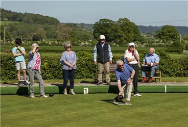 Visitors taking to the green. - Big Bowls Weekend